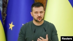 FILE - Ukraine's President Volodymyr Zelenskyy speaks in Kyiv, Ukraine, Sept. 20, 2024. Kremlin propaganda has included false stories of Zelenskyy buying yachts and preparing to flee his country for the U.S. 