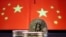 Representations of Bitcoin cryptocurrency are seen in front of an image of Chinese flags in this illustration picture taken June 2, 2021. 