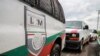 FILE - Vans of the Mexico's National Migration Institute (INM) are seen at a checkpoint on the outskirts of Tapachula, Chiapas State, Mexico, June 12, 2019. The head of the National Migration Institute, Tonatiuh Guillén López, has resigned. 