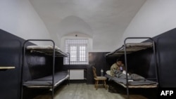 FILE - A photograph obtained from the Telegram account of V_Zelenskiy_official shows a man identified as a North Korean soldier detained by Ukrainian authorities at an undisclosed location in Ukraine, following his capture by the Ukrainian army.