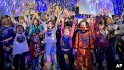 A man hugs Pope Francis to take a selfie after he had climbed on the popemobile at the end of the weekly general audience in St. Peter&#39;s Square at the Vatican.