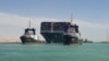 Kapal Ever Given, salah satu kapal kontainer terbesar di dunia, berhasil ditarik ke laut lepas setelah terjebak di tepian Terusan Suez, Senin, 29 Maret 2021.