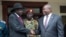 FILE - South Sudanese President Salva Kiir, left, and Vice President Riek Machar shake hands after meetings in Juba, South Sudan, on Oct. 20, 2019, to discuss outstanding issues to a peace deal.