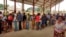 FILE - Congolese people line up to receive a vaccination against yellow fever in the Gombe district of the Democratic Republic of Congo's capital, Kinshasa, Aug. 17, 2016.