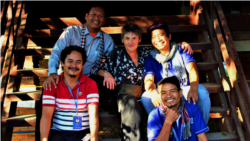 This file photo shows Srey Bandaul with French art teacher Véronique Decrop and his friends from the refugee camp, many years after they founded and run Phare Ponleu Selpak. (Courtesy of Phare Ponleu Selapak)