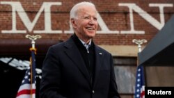 Joe Biden saat berkampanye untuk kandidat Senat dari Partai Demokrat di Atlanta, Georgia, Selasa (15/12). 