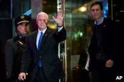 Vice President-elect Mike Pence, second from left, and Jared Kushner, son in-law of President-elect Donald Trump, right, depart Trump Tower, Dec. 7, 2016, in New York.