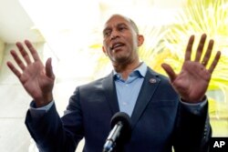 FILE - Rep. Hakeem Jeffries, D-N.Y., speaks with reporters after a Democratic caucus meeting on Capitol Hill, Oct. 1, 2021.