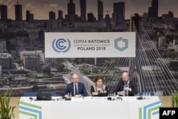 U.N. Climate chief Patricia Espinosa (C) is flanked by officials during a press conference at the COP24 climate change summit in Katowice, Poland, Dec. 2, 2018.