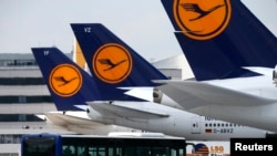 FILE - Lufthansa aircrafts sit on the tarmac at Frankfurt airport, July 12, 2013.