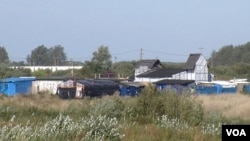 The 'Jungle' migrant camp, seen here, is due to be completely demolished by year's end, in Calais, France. (L. Bryant/VOA)