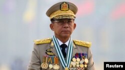 FILE PHOTO: Myanmar's junta chief Senior General Min Aung Hlaing, who ousted the elected government in a coup, presides at an army parade on Armed Forces Day in Naypyitaw, Myanmar, March 27, 2021. 