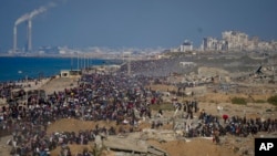 Palestinians return to northern Gaza, amid destroyed buildings, following Israel's decision to allow thousands of them to return for the first time since the early weeks of the 15-month war with Hamas, Jan. 27, 2025. 