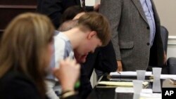 FILE - Joseph Roof, grandfather of Dylan Roof, walks past his grandson to address the court as Dylann Roof appears in the Charleston County Court Monday April 10, 2017 to enter his guilty plea on murder charges in Charleston, S.C. 
