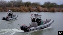 Border Patrol agents cruise along the Rio Grande at the U.S.-Mexico border, Feb. 13, 2025, in McAllen, Texas.
