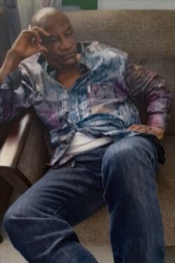 A screengrab taken from footage sent to AFP by a military source shows the President of Guinea Conakry Alpha Conde after he was captured by army putschists during a coup d'etat in Conakry on September 5, 2021.
