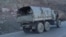 FILE - Armenian soldiers drive on a truck while leaving Karvatchar town in Nagorno-Karabakh, Nov. 24, 2020. Tensions have again risen between Armenia and Azerbaijan over the contested region.