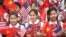 Vietnamese students hold U.S. and Vietnamese flags at a welcoming ceremony for U.S. President Barack Obama at the Presidential Palace in Hanoi, Vietnam, May 23, 2016.