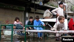 Refugees, who fled the military offensive against the Pakistani militants in North Waziristan, sit on a bed in Bannu, Khyber-Pakhtunkhwa, Pakistan, June 19, 2014. 