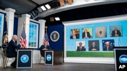 President Joe Biden adresses participants of the Major Economies Forum on Energy and Climate, in the South Court Auditorium on the White House campus, in Washington, Sept. 17, 2021, as Secretary of State Antony Blinken listens. 