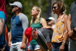 Mourners gather at a vigil following a nearby mass shooting in Dayton, Ohio, Aug. 4, 2019.
