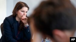 FILE - Sarah Moriarty, the daughter of Robert Levinson, a U.S. hostage in Iran, listens during a news conference in Washington, Dec. 3, 2019.