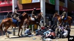 FILE - Police on horses surround protesters during protests against abductions in Nairobi, Dec. 30, 2024.