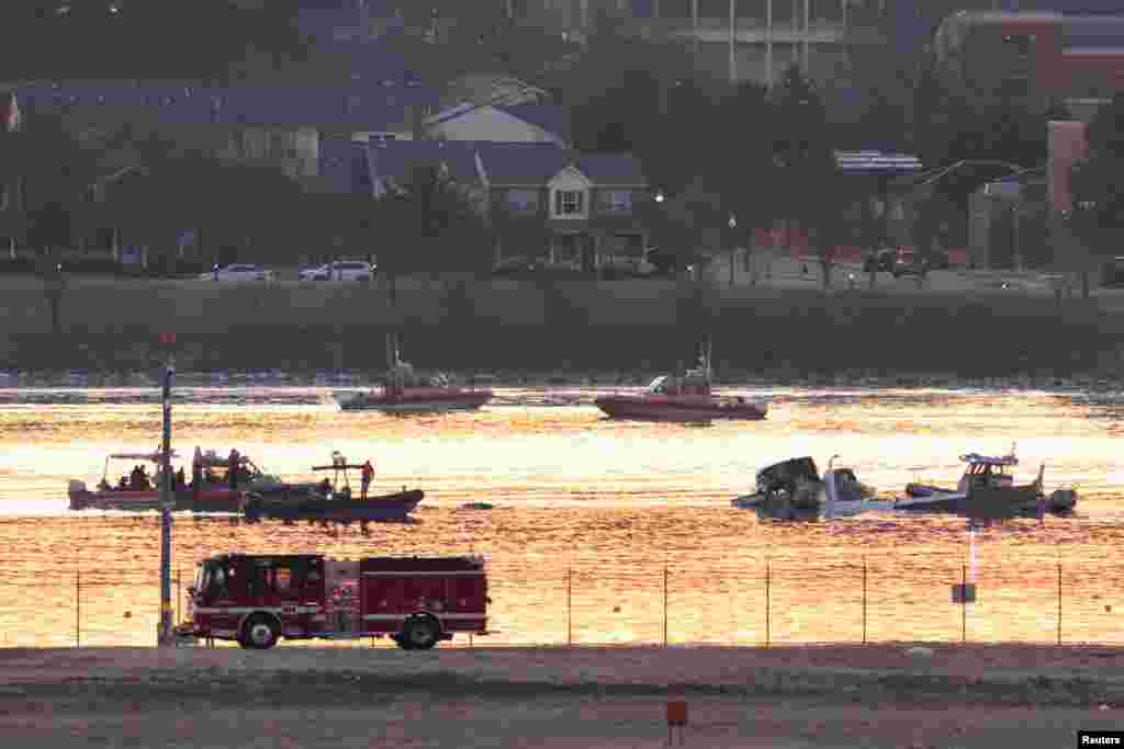 Emergency personnel work at the site of the crash after a Black Hawk helicopter and an American Eagle flight 5342 approaching Reagan Washington National Airport collided and crashed in the Potomac River, outside Washington, Jan. 30. 2025. 