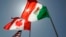 FILE - National flags representing the United States, Canada, and Mexico fly in the breeze in New Orleans where leaders of the North American Free Trade Agreement met on April 21, 2008. 