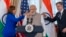 FILE - Vice President Kamala Harris, India's Prime Minister Narendra Modi, and Secretary of State Antony Blinken, share a toast during a State Visit Luncheon at the State Department, June 23, 2023, in Washington.