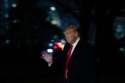 President Donald Trump waves as he walks on the South Lawn of the White House, with the U.S. Capitol in the background, after returning from a trip to Florida and a Republican National Committee meeting, Jan. 23, 2020, in Washington.