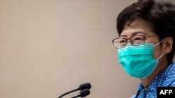 Hong Kong's Chief Executive Carrie Lam takes part in a press conference while wearing a face mask in Hong Kong on March 3, 2020. 