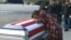 FILE - In this frame from video, Myeshia Johnson cries over the casket in Miami, Florida, Oct. 17, 2017, of her husband, Sgt. La David Johnson, who was killed in an ambush in Niger. 