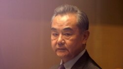 FILE PHOTO: China's Foreign Minister Wang Yi listens during a meeting in Manila, Philippines on Jan. 16, 2021.