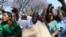 Zimbabwean medical staff march on the streets of Harare, Sept. 19, 2019.