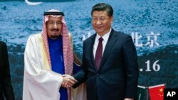 Saudi King Salman, left, and Chinese President Xi Jinping shake hands in Beijing, China, March 16, 2017.