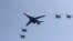 FILE - A U.S. B-1 bomber, center, flies over Osan Air Base with U.S. jets in Pyeongtaek, South Korea, Tuesday, Sept. 13, 2016.