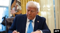 U.S. President Donald Trump signs an executive order in the Oval Office of the White House in Washington, Feb. 4, 2025. He recently signed an order to establish an "Iron Dome" to defend the United States.