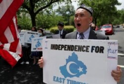 Demonstrators hold a protest in front of the State Department to urge the U.S. and the international community to take action against China's treatment of the Uyghur people, May 5, 2021.