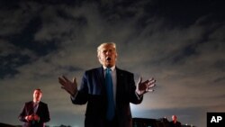President Donald Trump talks with reporters at Andrews Air Force Base after attending a campaign rally in Latrobe, Pa., Sept. 3, 2020, at Andrews Air Force Base, Md. 