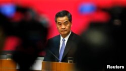 Hong Kong Chief Executive Leung Chun-ying looks on during a news conference in Hong Kong, July 15, 2014.