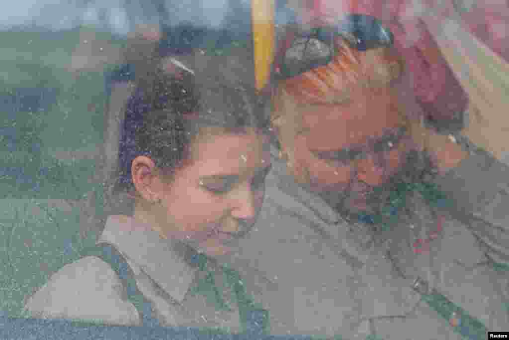 Evacuees from Mariupol travel in a convoy to Zaporizhzhia