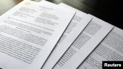 Laporan akhir Jaksa Khusus Robert Mueller tentang intervensi Rusia dalam pilpres AS 2016, di Washington, 24 Maret 2019. (Foto: Jim Bourg/Reuters)