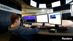 FILE - An employee works at the headquarters of Kaspersky Lab, a computer security company, in Moscow, Russia, July 29, 2013.