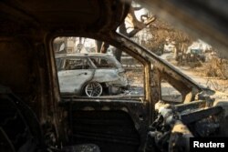 Incinerated vehicles remain following the Palisades Fire at the Pacific Palisades neighborhood in Los Angeles, California, on Jan. 10, 2025.