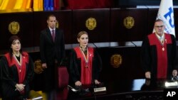 Venezuelan Supreme Court judges, from left, Fanny Marquez, Caryslia Rodriguez and Inocencio Figueroa stand during a ceremony after the court's audit of the disputed results of the presidential election, in Caracas, Aug. 22, 2024.