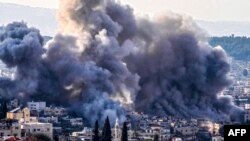 Smoke billows from the site of several explosions during an Israeli raid on the Jenin camp for Palestinian refugees, Feb. 2, 2025.