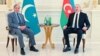 Pakistan's Prime Minister Shehbaz Sharif, left, is seen meeting with Azerbaijan's President Ilham Aliyev in Baku, Azerbaijan, in a photo posted by Sharif Feb. 24, 2025, on his X account (@CMShehbaz).
