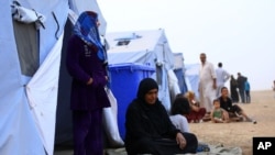 Fleeing insurgents, refugees from the Iraqi city of Mosul find shelter at Khazir camp near Irbil on June 12, 2014.