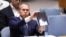 Israeli Ambassador to the UN Gilad Erdan shows a video of drones and missiles heading toward Israel during a United Nations Security Council meeting on the situation in the Middle Eas at UN headquarters in New York City on April 14, 2024. 
